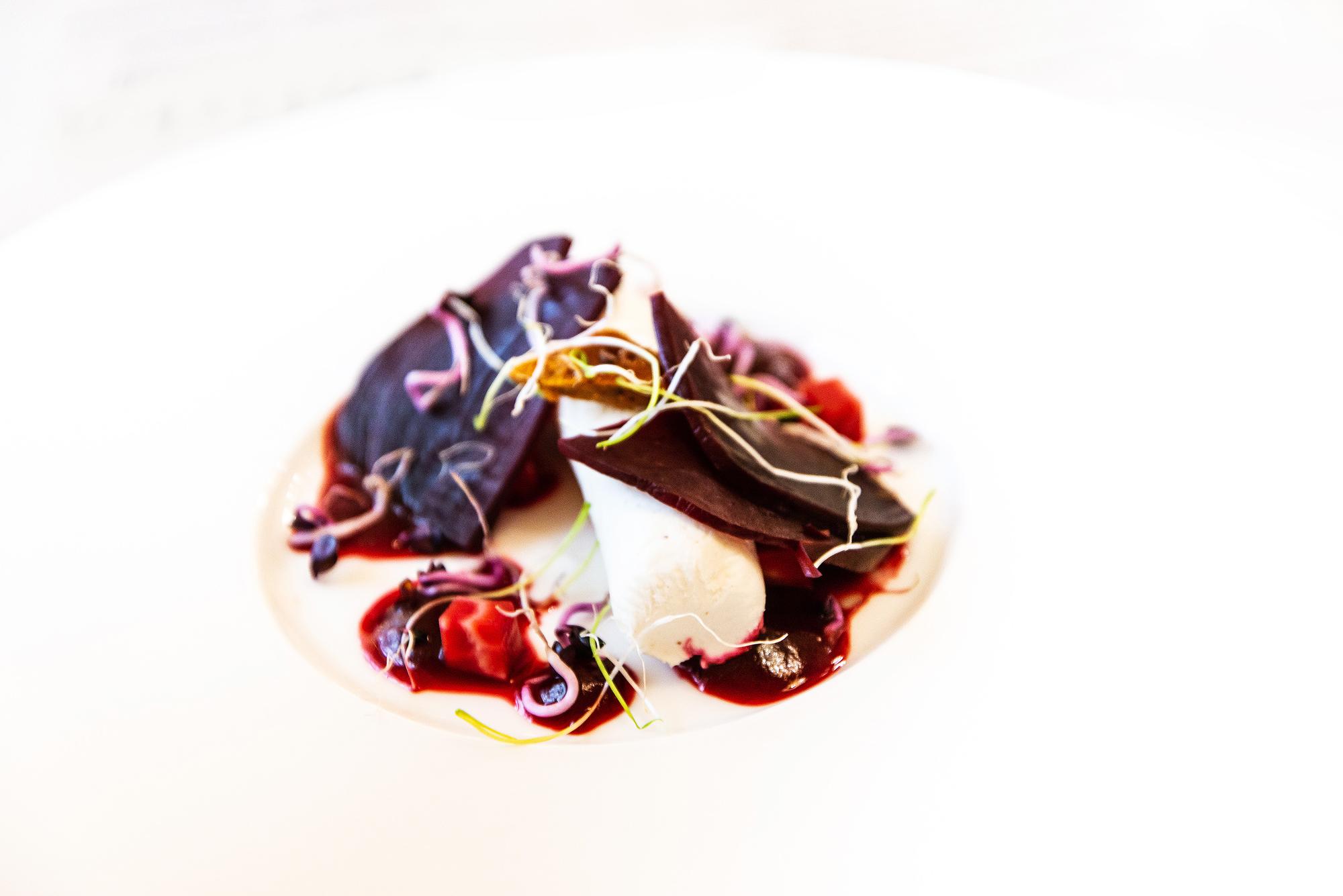 Chef plating a contemporary Lithuanian dish